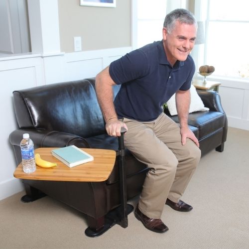 Omni Tray Couch Stand Up Image of man standing up from couch with Omni Tray next to him.